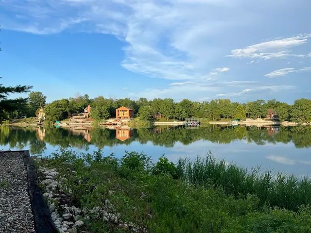 a view of lake and houses with outdoor space