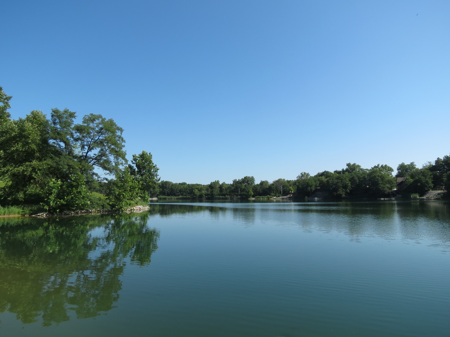 423 Mallard Point Drive Danville, IL 61834 - Photo 31 of 40 a view of a lake with houses in background