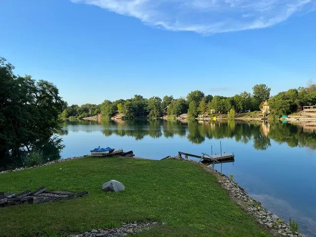 a view of a lake with houses in the back
