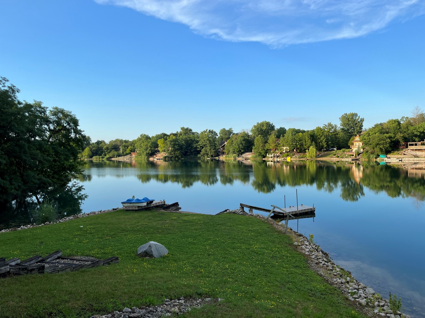 423 Mallard Point Drive Danville, IL 61834 - Photo 4 of 40 a view of a lake with houses in the back