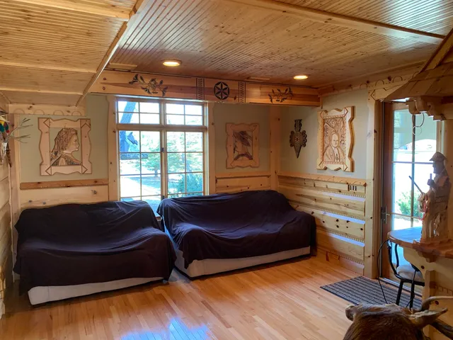 a bedroom with furniture and a window