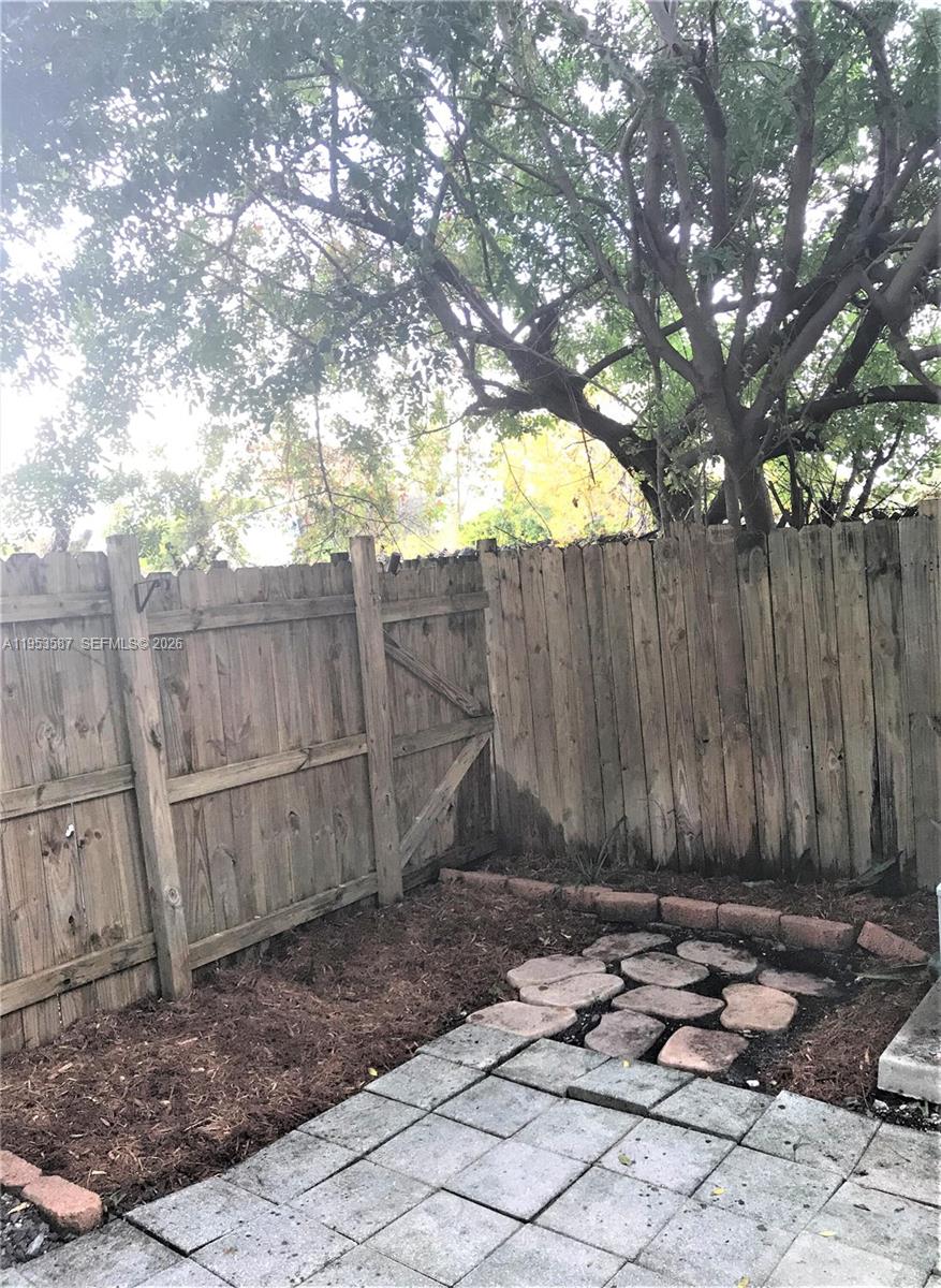 2201 Monroe Street, Unit B2 Hollywood, FL 33020 - Photo 12 of 12 a backyard of a house with a tree