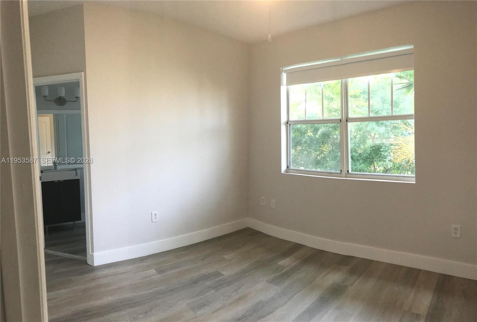 2201 Monroe Street, Unit B2 Hollywood, FL 33020 - Photo 5 of 12 an empty room with a window