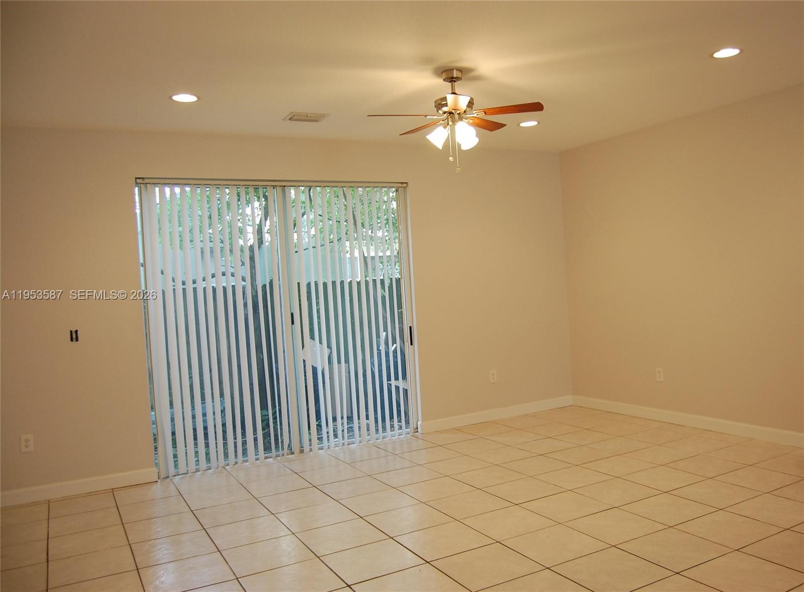 2201 Monroe Street, Unit B2 Hollywood, FL 33020 - Photo 9 of 12 a view of a livingroom and a chandelier fan