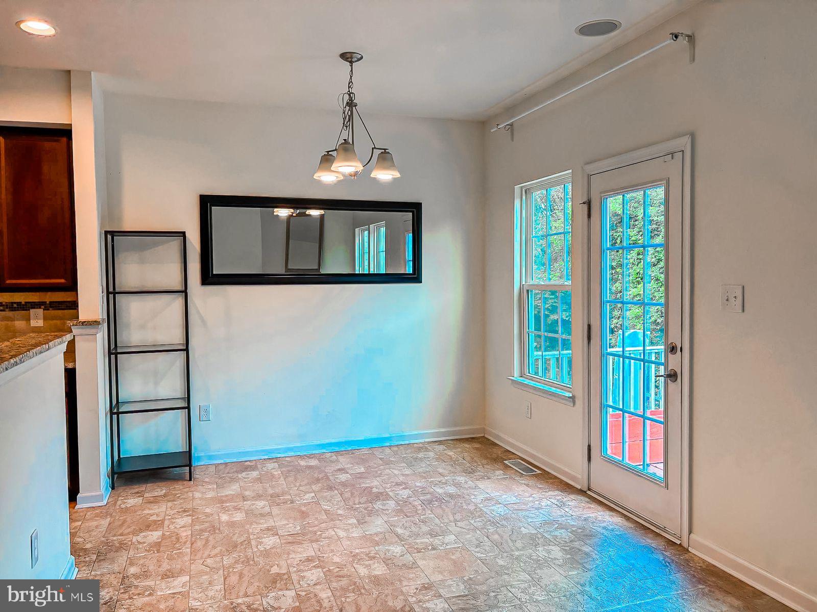 63 Franklin Circle, Unit 63 Somerdale, NJ 08083 - Photo 5 of 18 a view of an empty room and window