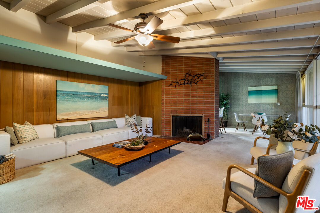 11368 Berwick Street Los Angeles, CA 90049 - Photo 25 of 31 a living room with furniture and a fireplace