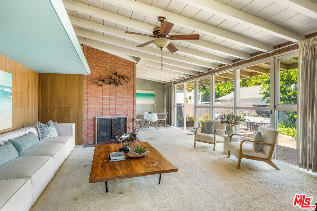 11368 Berwick Street Los Angeles, CA 90049 - Photo 6 of 31 a living room with furniture and a flat screen tv