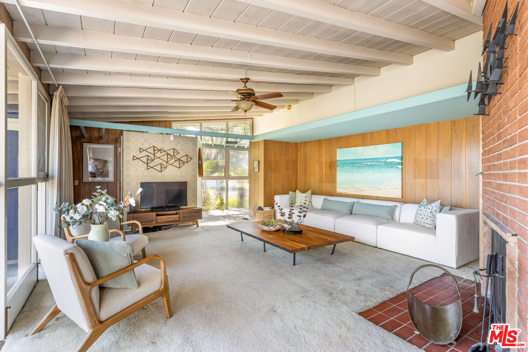 11368 Berwick Street Los Angeles, CA 90049 - Photo 7 of 31 a living room with furniture and a fireplace