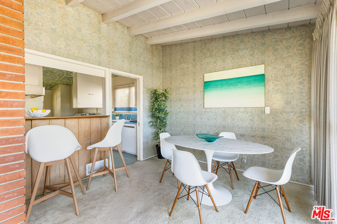 11368 Berwick Street Los Angeles, CA 90049 - Photo 9 of 31 a view of a dining room with furniture and wooden floor