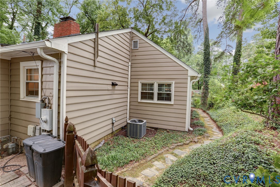 1401 Chowan Road Henrico, VA 23229 - Photo 31 of 39 Exterior siding with a red brick chimney, featurin