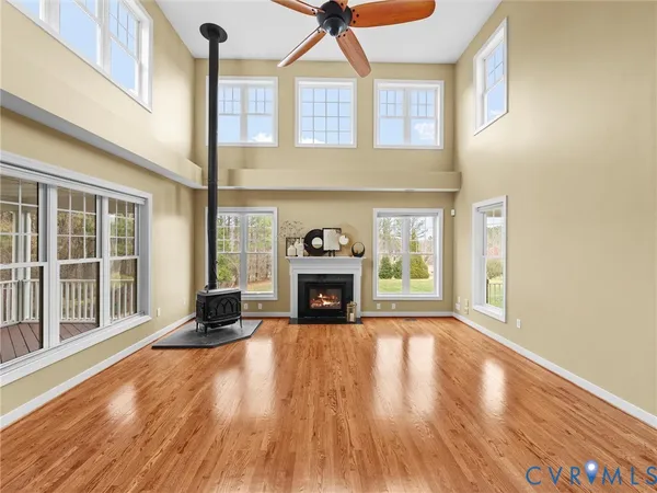a view of a living room with furniture and wooden floor