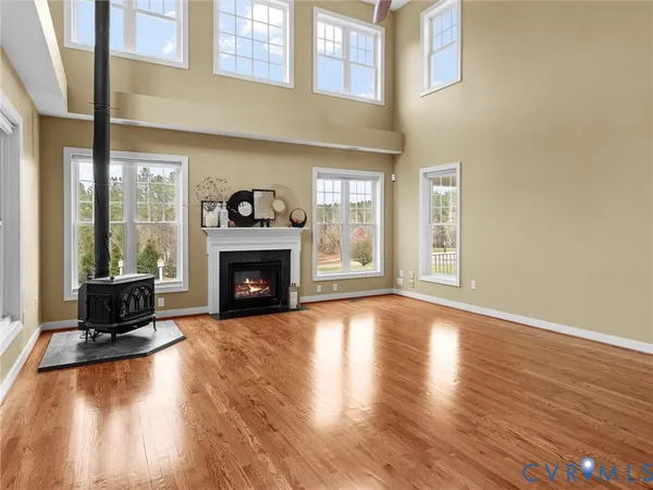 a view of a livingroom with a ceiling fan and a bathroom
