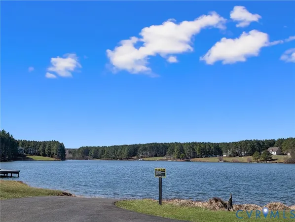 a view of a room with wooden floor and chandelier