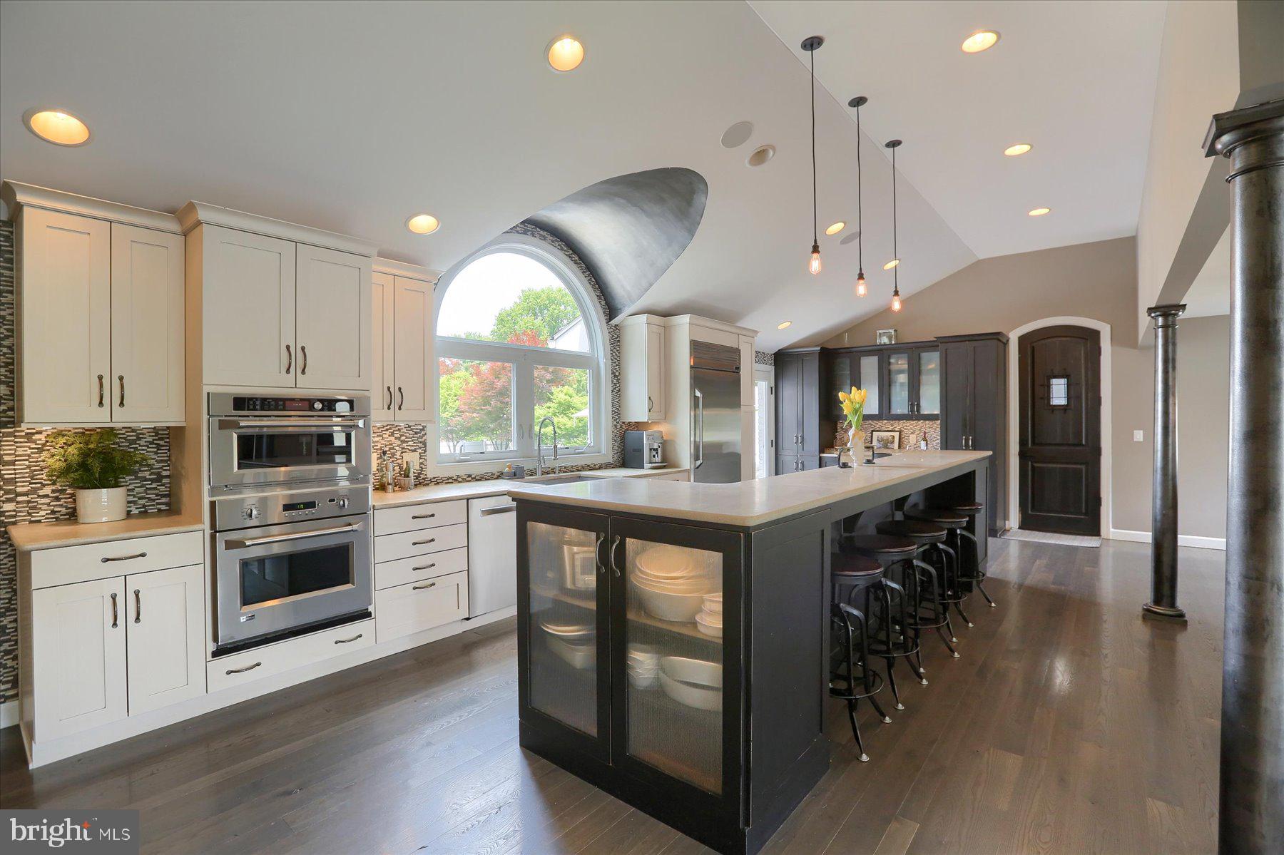 503 Maple Avenue Hershey, PA 17033 - Photo 13 of 43 a kitchen with stainless steel appliances granite countertop a lot of counter space and wooden floors