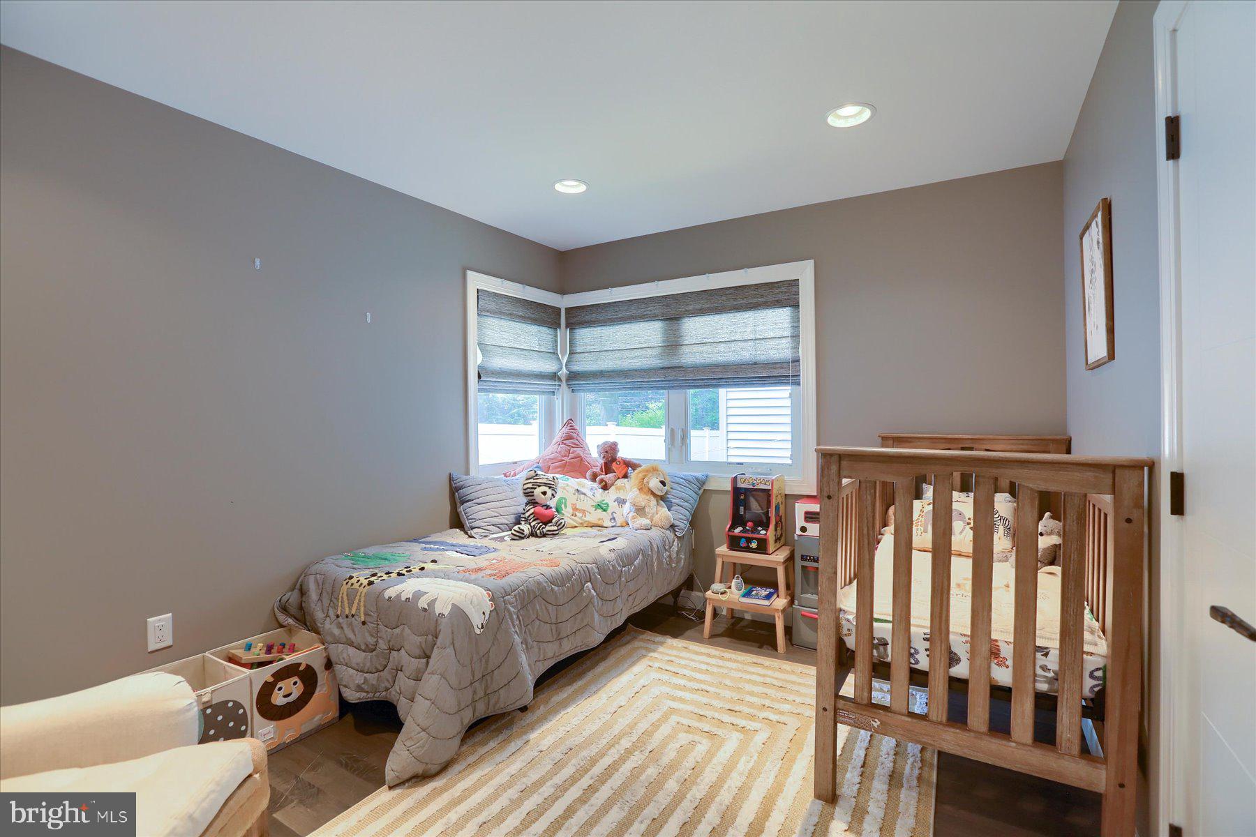 503 Maple Avenue Hershey, PA 17033 - Photo 30 of 43 a bedroom with a bed and wooden floor