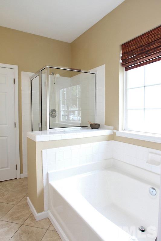 4717 Delta Ridge Court Raleigh, NC 27612 - Photo 16 of 25 Tile shower and separate tub