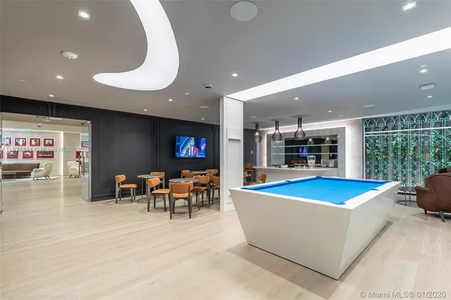 a view of a swimming pool with outdoor seating