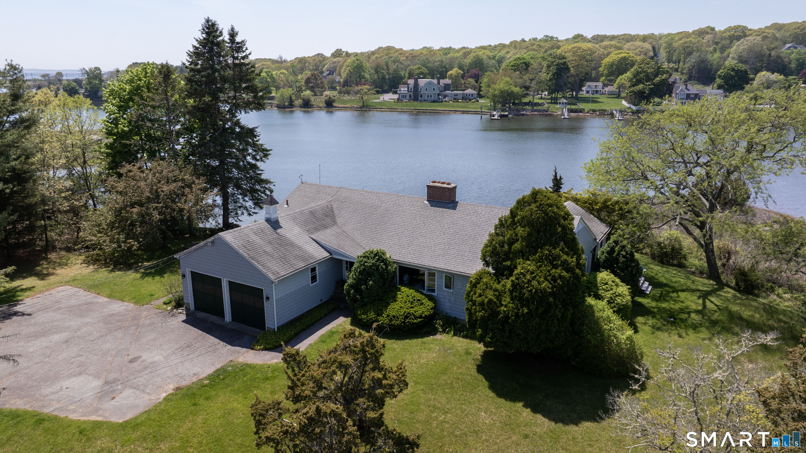 27 Wilbur Road Stonington, CT 06378 - Photo 34 of 40 a view of a house with a yard and a pool