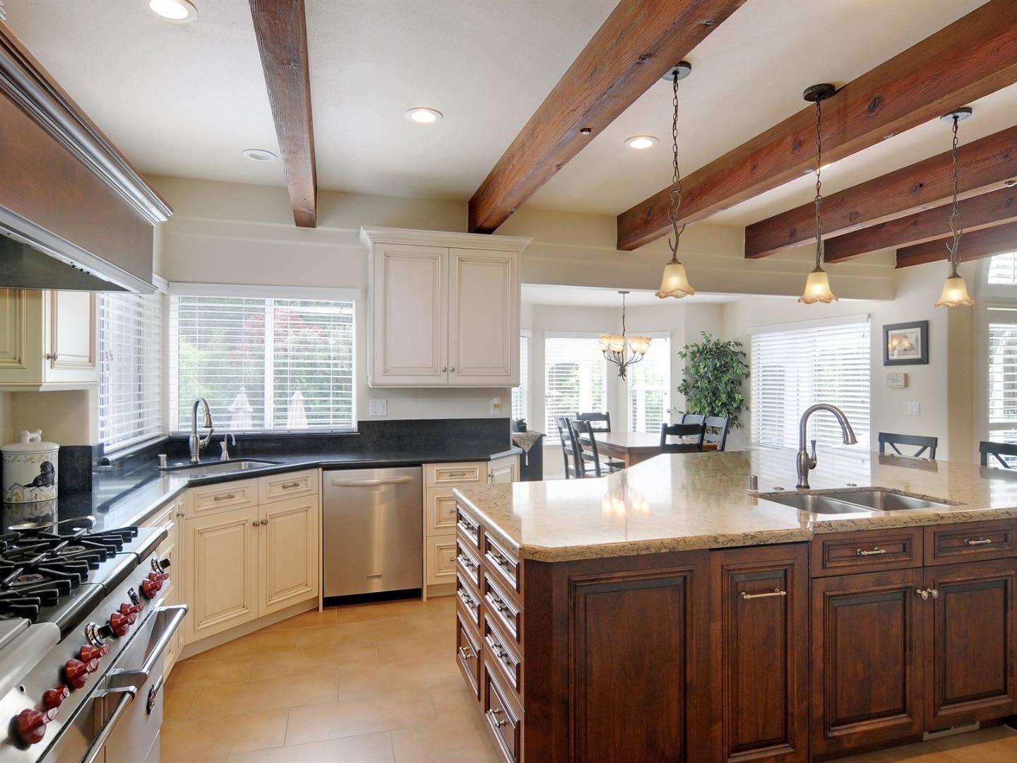 10035 Burchell Road Gilroy, CA 95020 - Photo 16 of 55 a kitchen with lots of counter space a sink and a large window