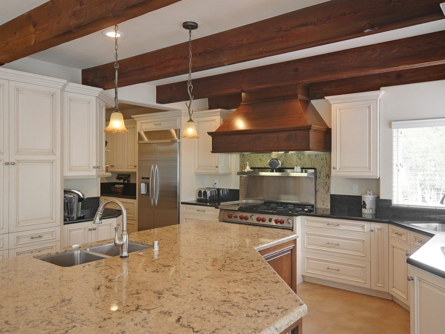 10035 Burchell Road Gilroy, CA 95020 - Photo 17 of 55 a kitchen with counter top space cabinets and stainless steel appliances