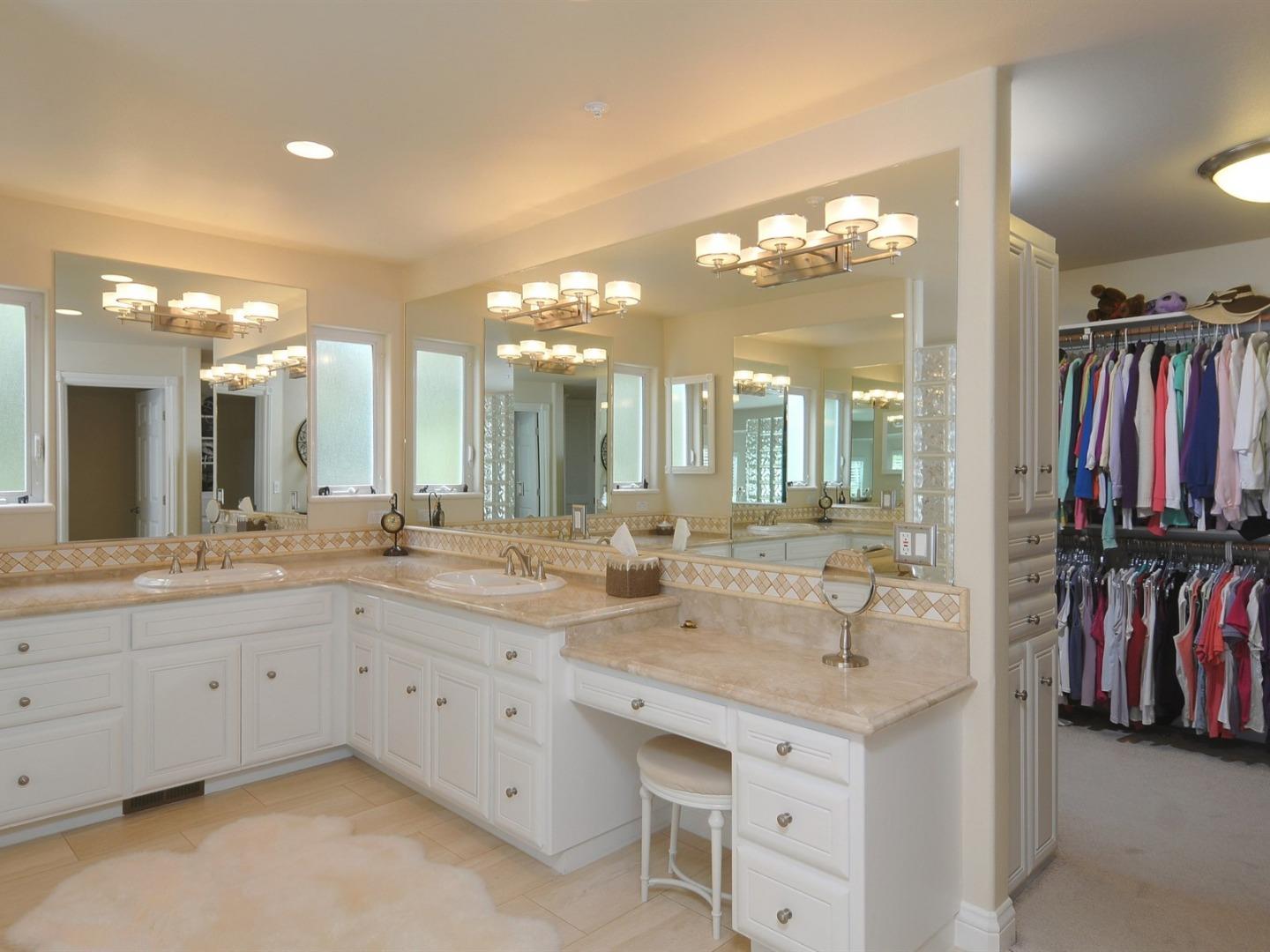 10035 Burchell Road Gilroy, CA 95020 - Photo 22 of 55 a bathroom with a sink vanity and a mirror