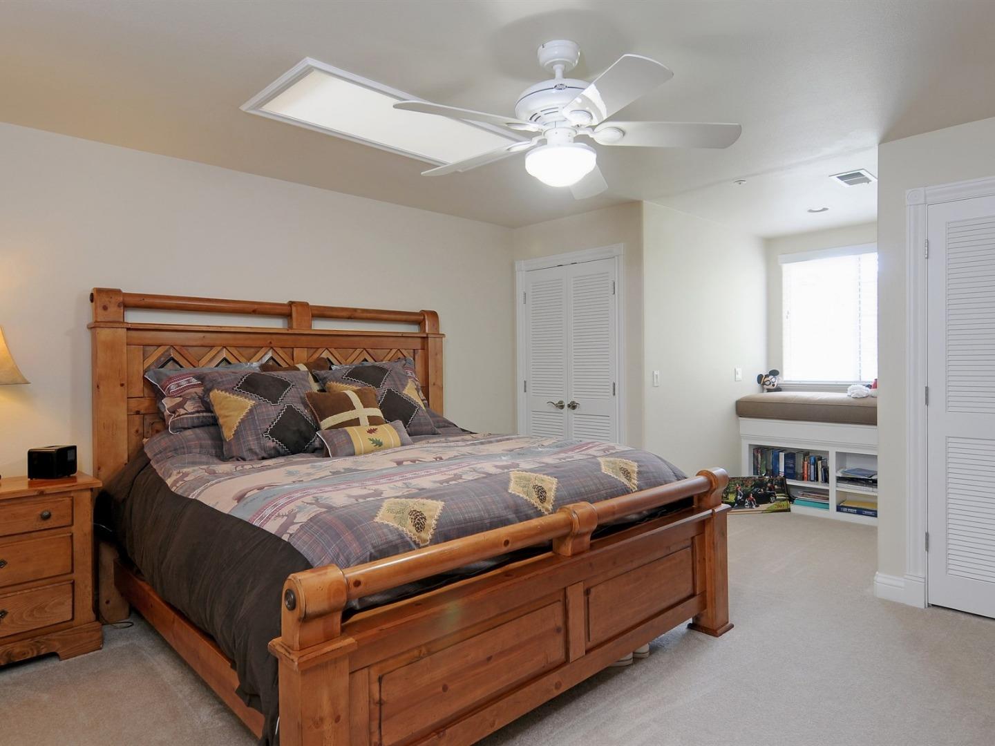10035 Burchell Road Gilroy, CA 95020 - Photo 25 of 55 a bed room with furniture and a chandelier