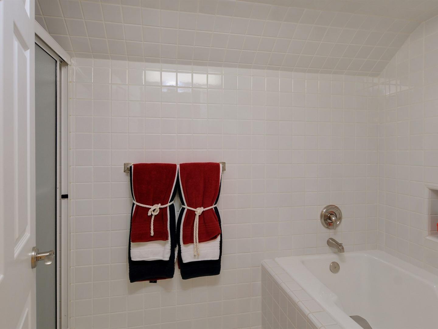 10035 Burchell Road Gilroy, CA 95020 - Photo 29 of 55 a bathroom with a bathtub and shower