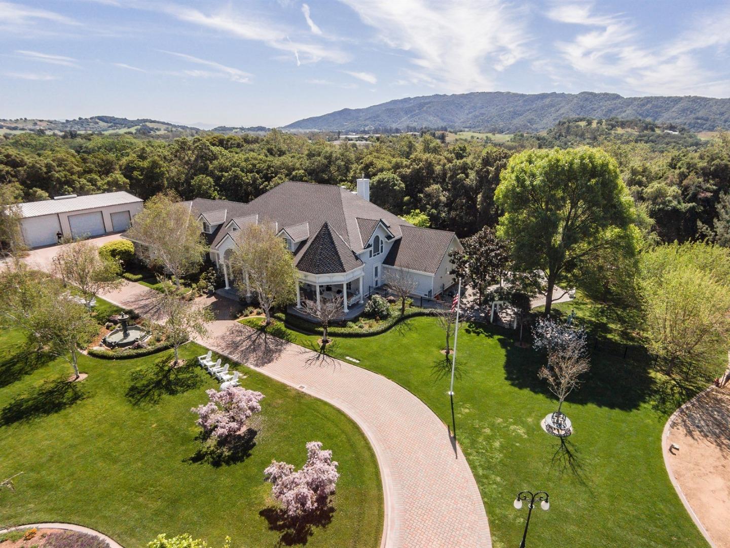10035 Burchell Road Gilroy, CA 95020 - Photo 3 of 55 a view of a house with a yard and a garden