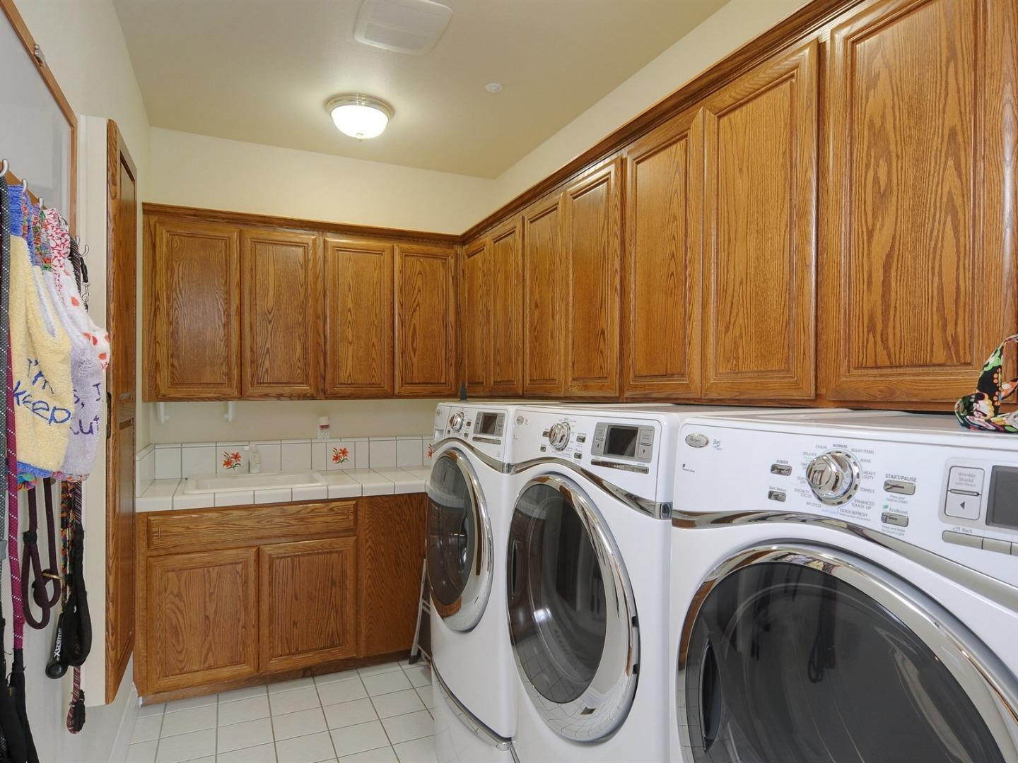 10035 Burchell Road Gilroy, CA 95020 - Photo 37 of 55 a utility room with dryer and washer