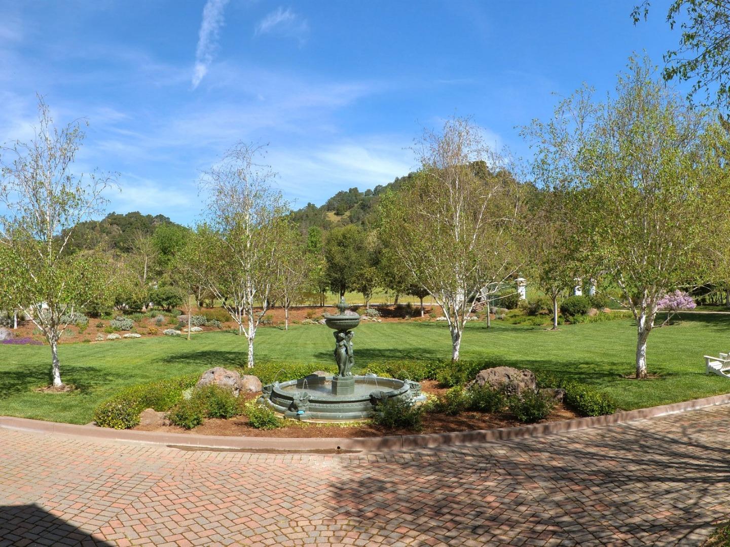 10035 Burchell Road Gilroy, CA 95020 - Photo 7 of 55 a view of a park with large trees and a houses