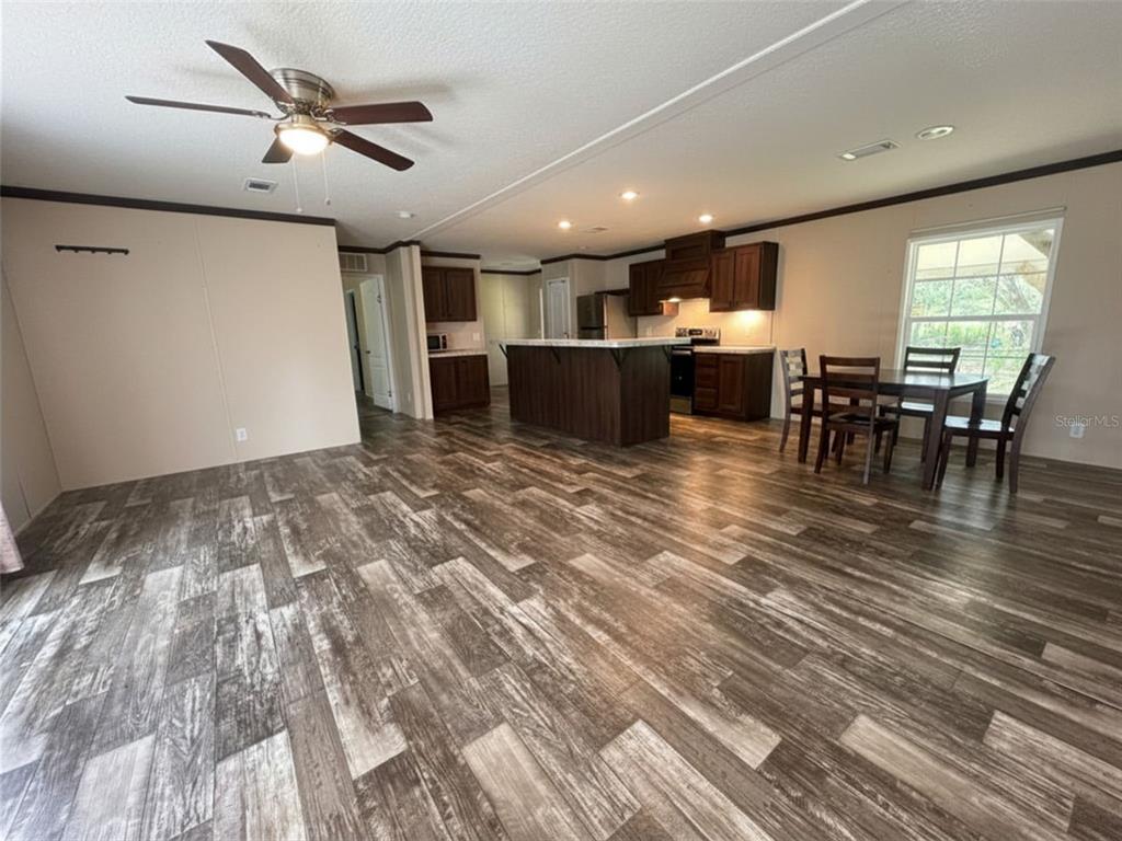 9827 Southeast Hoth Road Arcadia, FL 34266 - Photo 12 of 28 a view of a room with wooden floor