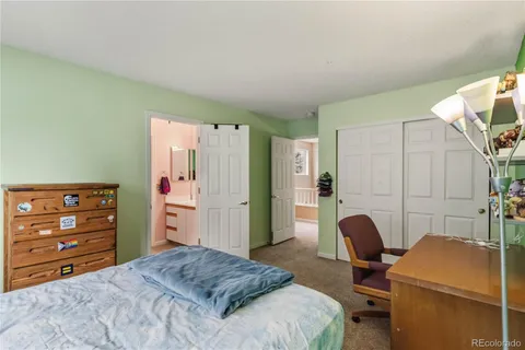 a bedroom with a bed and furniture