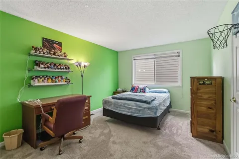 a bedroom with a bed and furniture