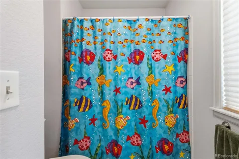 a bedroom with a bed and a flat tv screen