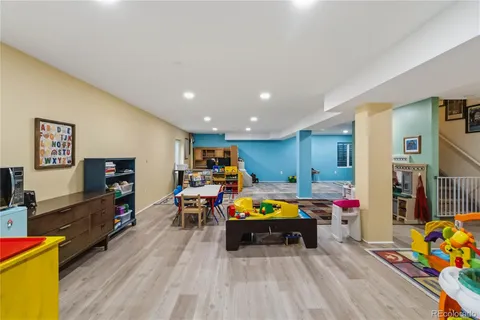 a living room with fireplace furniture and a flat screen tv