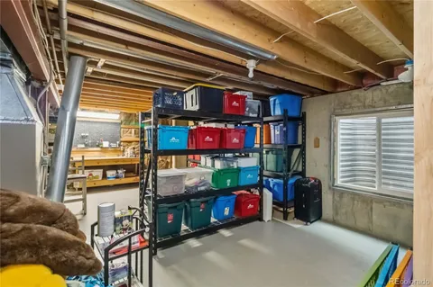 a view of a patio with table and chairs and wooden floor