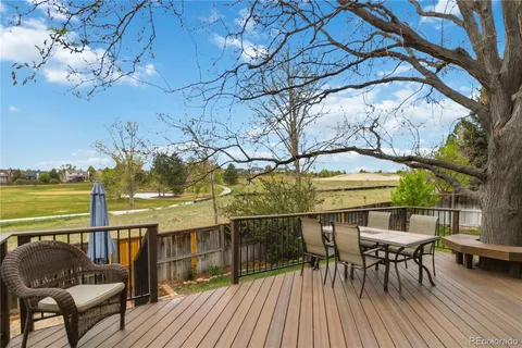 a view of a balcony with chairs