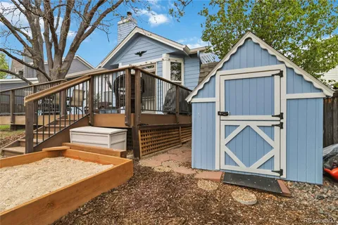 an aerial view of a house with outdoor space