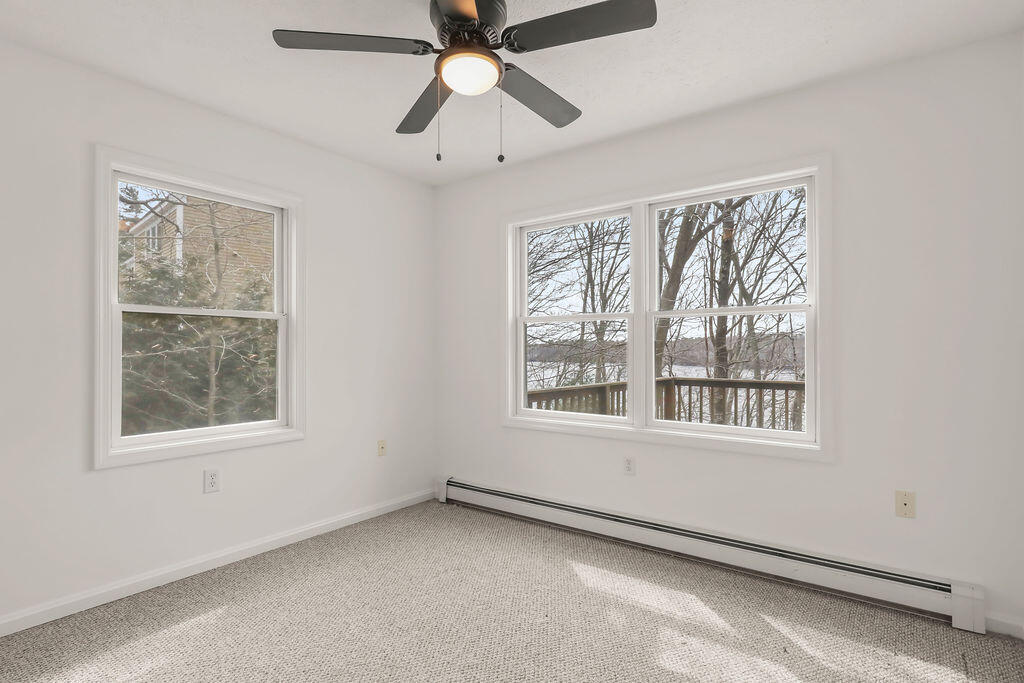 75 Edgewater Road Mashpee, MA 02649 - Photo 20 of 78 an empty room with a window and a fan