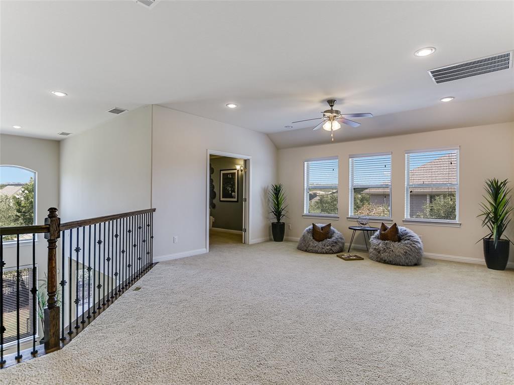2657 Montebelluna Place Leander, TX 78641 - Photo 16 of 29 Sitting room with plenty of natural light, carpet flooring, recessed lighting, and a ceiling fan