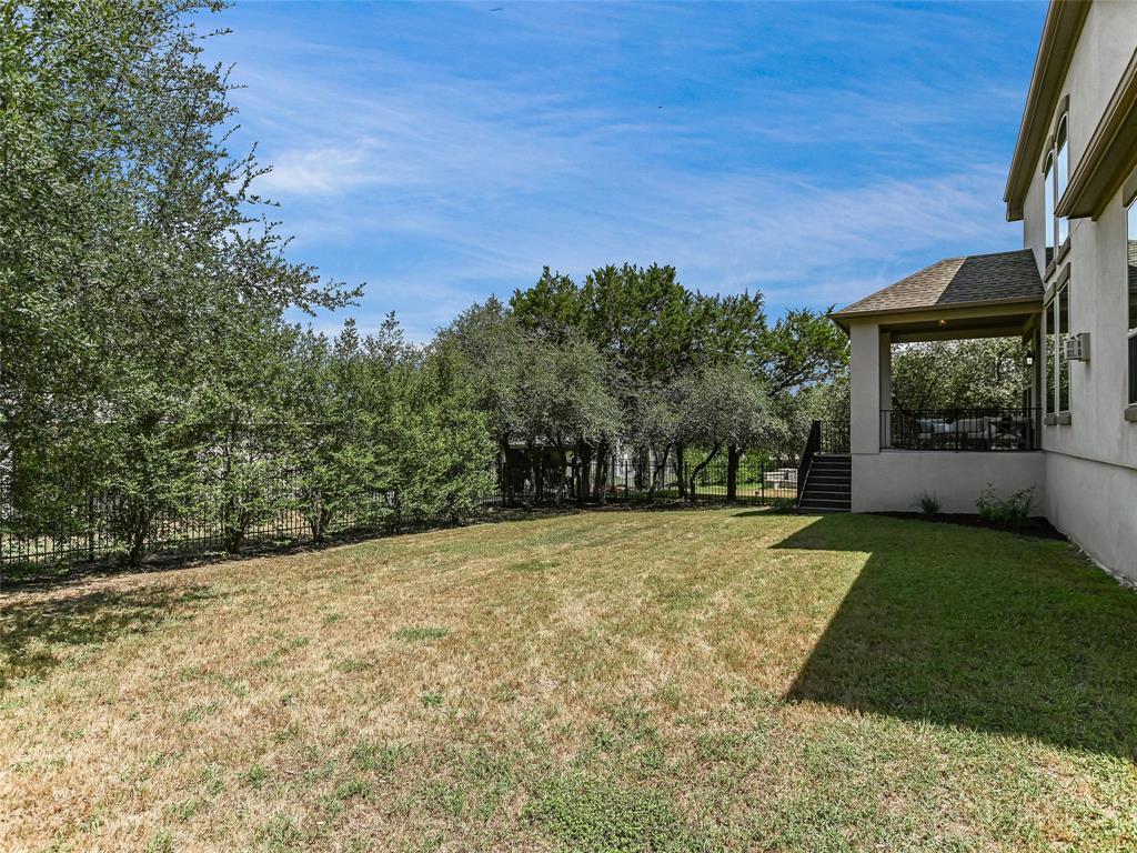 2657 Montebelluna Place Leander, TX 78641 - Photo 20 of 29 a backyard of a house with lots of green space