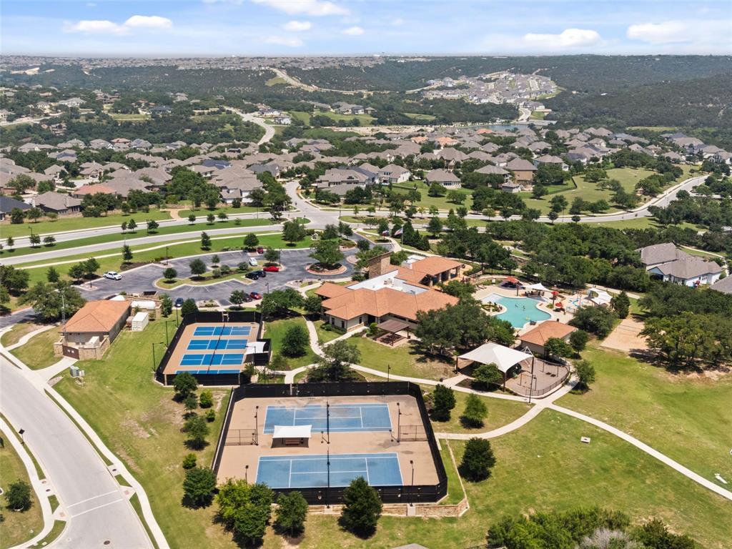 2657 Montebelluna Place Leander, TX 78641 - Photo 25 of 29 Aerial perspective of suburban area with a pool area