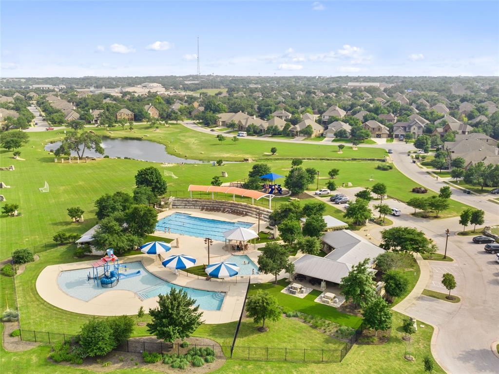2657 Montebelluna Place Leander, TX 78641 - Photo 26 of 29 Aerial perspective of suburban area featuring a large body of water and a golf course