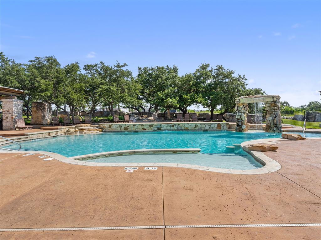 2657 Montebelluna Place Leander, TX 78641 - Photo 28 of 29 Community pool with a patio area