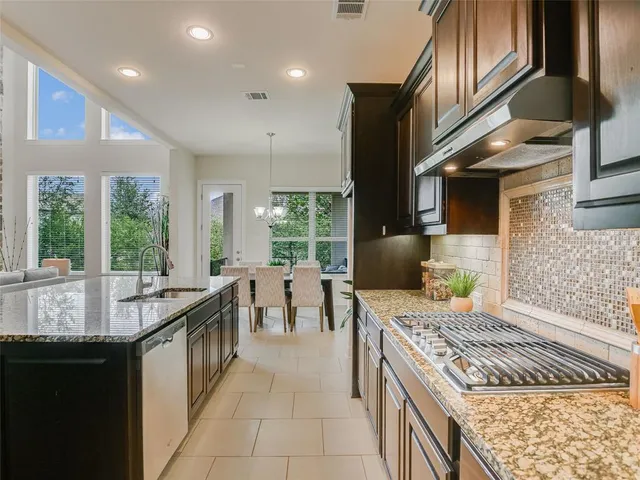 a kitchen with a stove and a sink