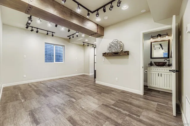 a kitchen with stainless steel appliances kitchen island granite countertop a stove and a refrigerator