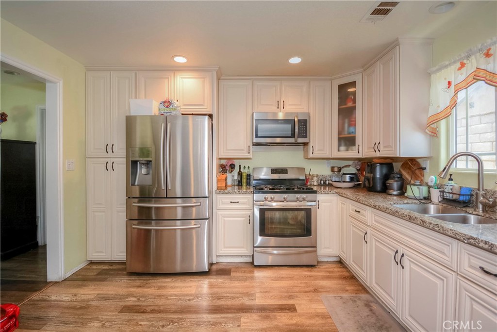 4320 Ambs Drive Riverside, CA 92505 - Photo 20 of 35 a kitchen with stainless steel appliances a refrigerator sink and microwave