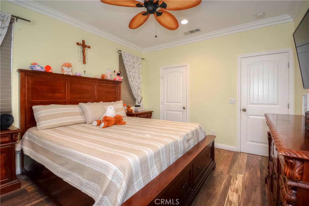 4320 Ambs Drive Riverside, CA 92505 - Photo 27 of 35 a bedroom with bed and wooden floor