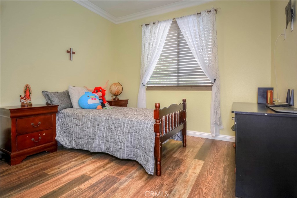 4320 Ambs Drive Riverside, CA 92505 - Photo 31 of 35 a bedroom with a bed and a window