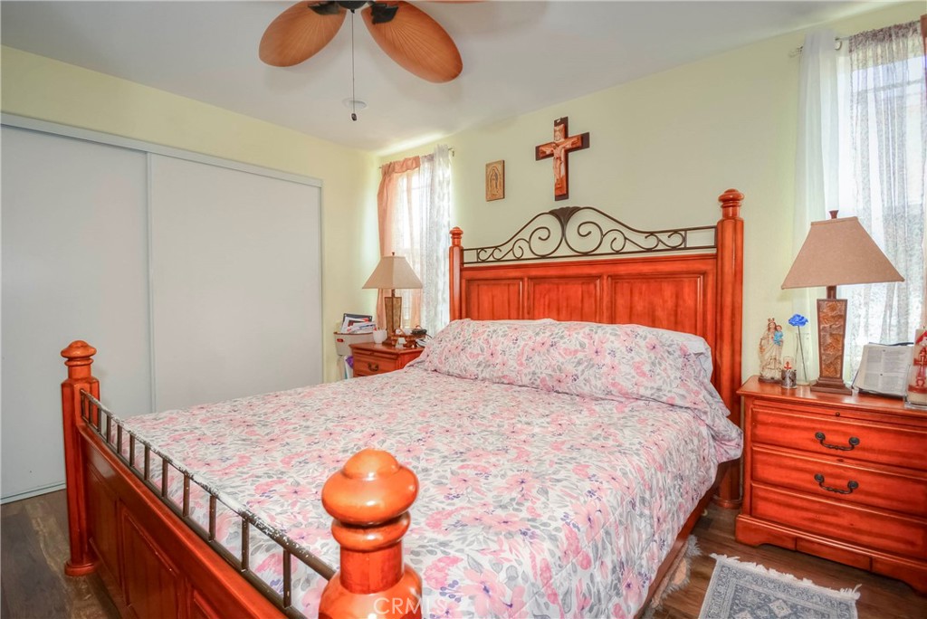 4320 Ambs Drive Riverside, CA 92505 - Photo 35 of 35 a bedroom with a bed and a chandelier